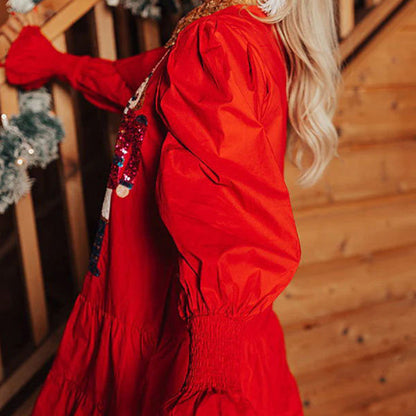 Langärmeliges Minikleid mit Nussknacker-Pailletten und Knopfleiste