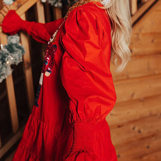 Langärmeliges Minikleid mit Nussknacker-Pailletten und Knopfleiste
